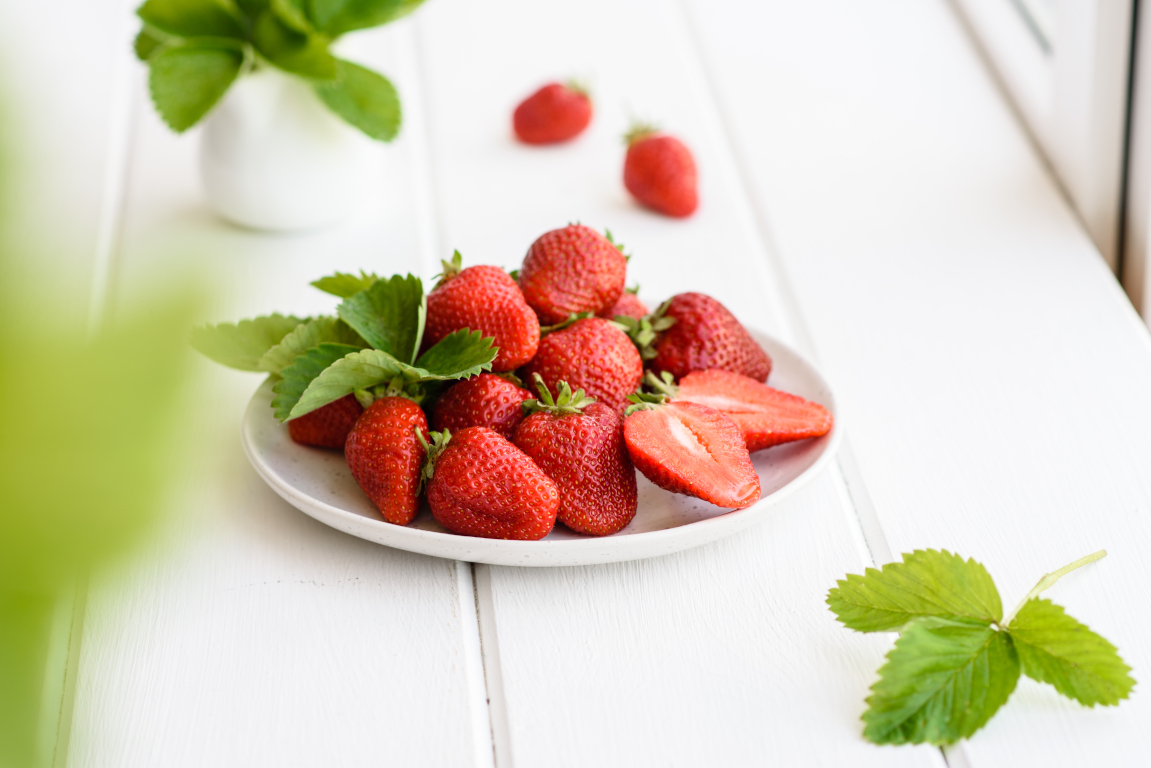 Fresh juicy strawberries with leaves. Fresh summer crop of strawberry berries