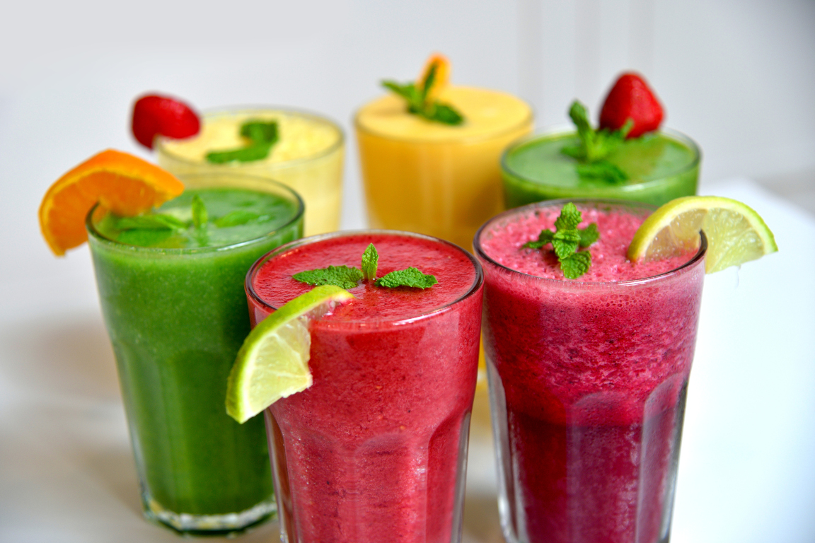 Fruit smoothies with dragon fruit, kiwi, watermelon, Pineapple on white background, Top view.